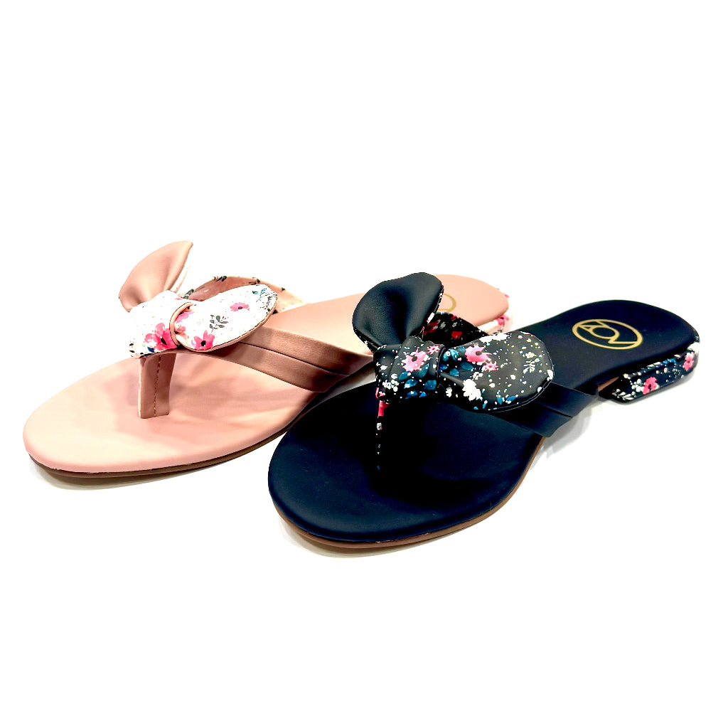 Pair of sandals with floral designs on a white background