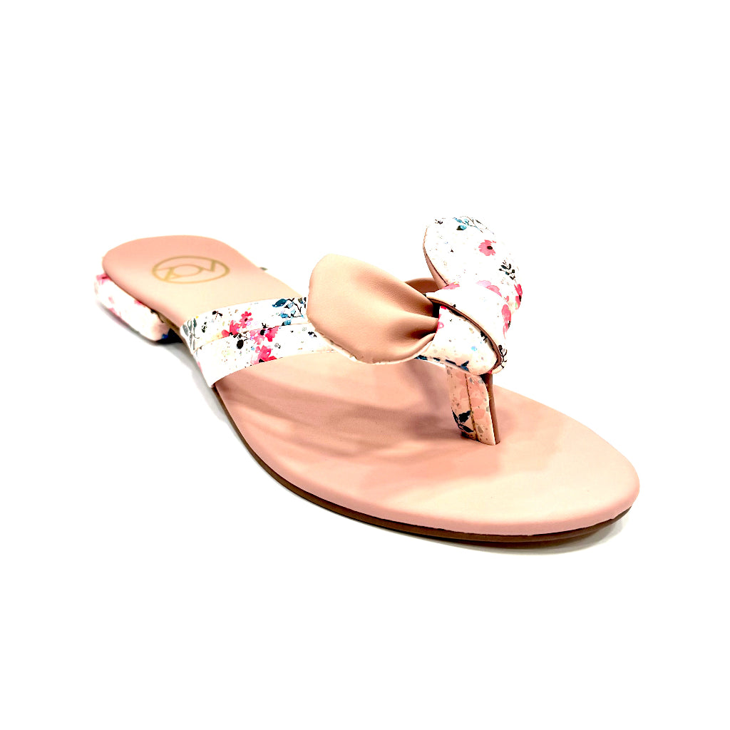 Pink sandal with floral design on a white background