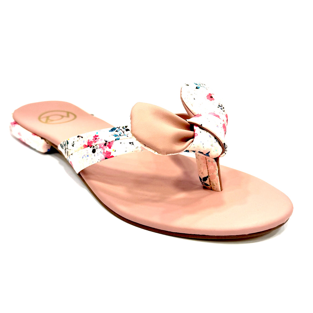 Pink sandal with floral strap on a white background